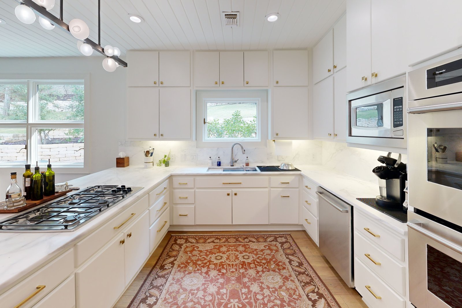 A bright residential kitchen with views through to the garden