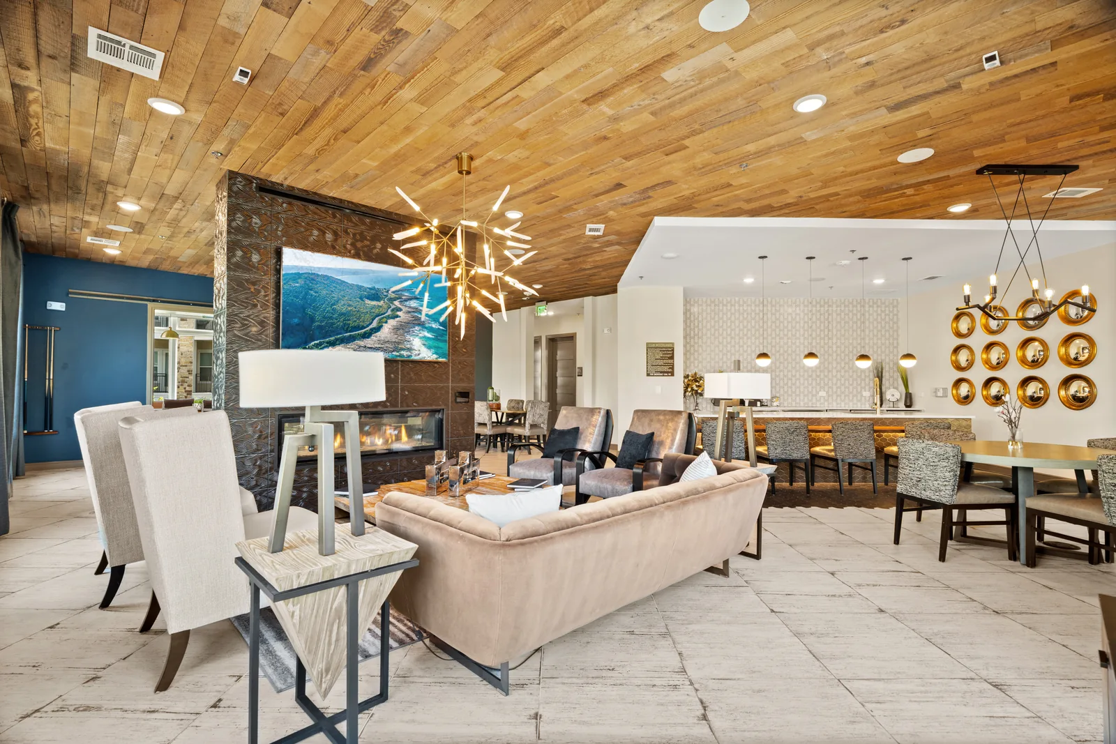 Apartment clubhouse with lounge seating and a wood ceiling
