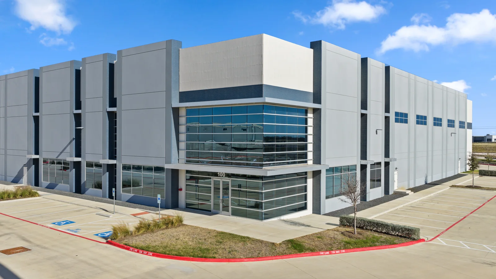 Modern commercial building with a glazed corner facade