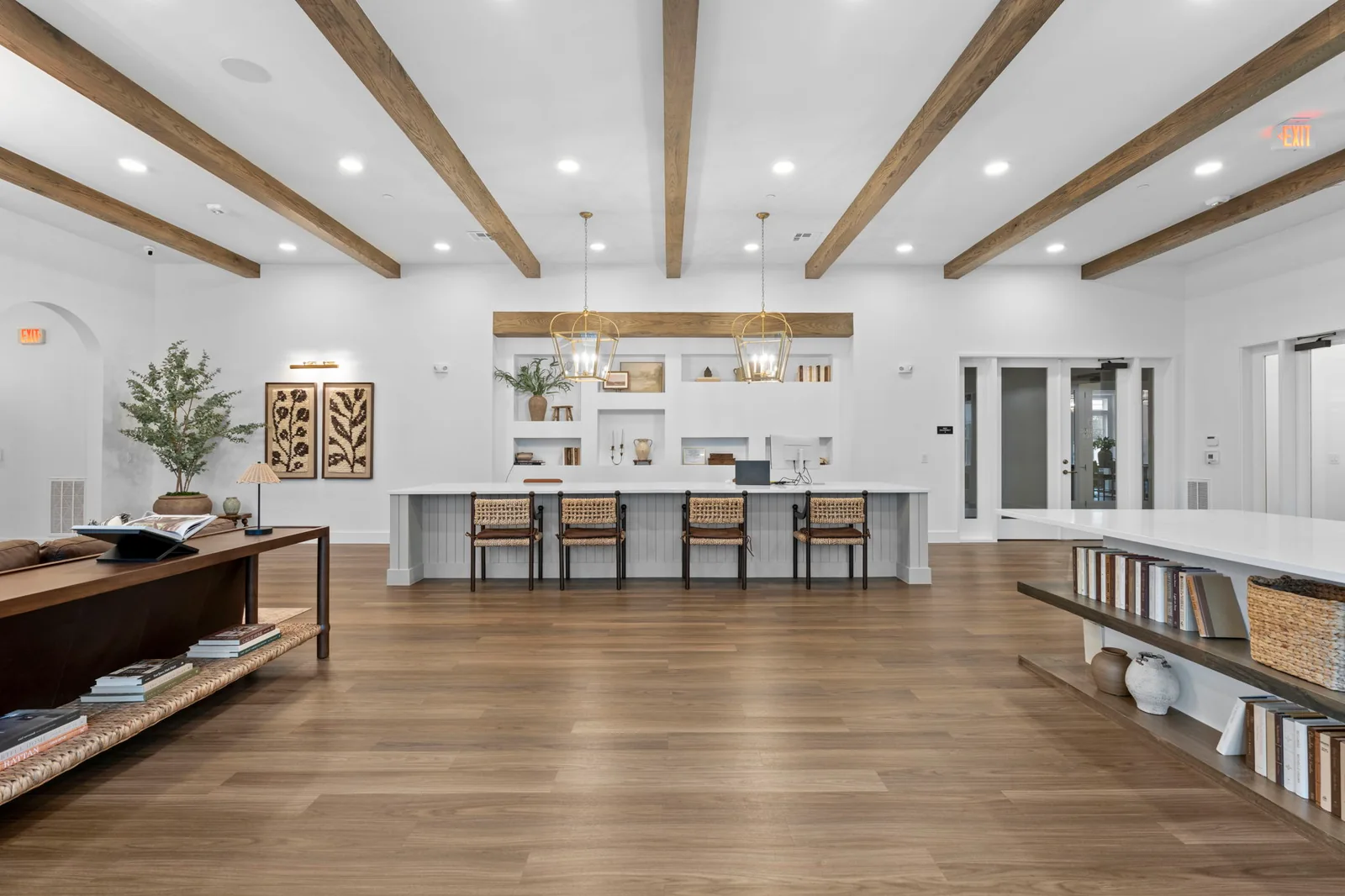 Open kitchen and living area with exposed wood beams