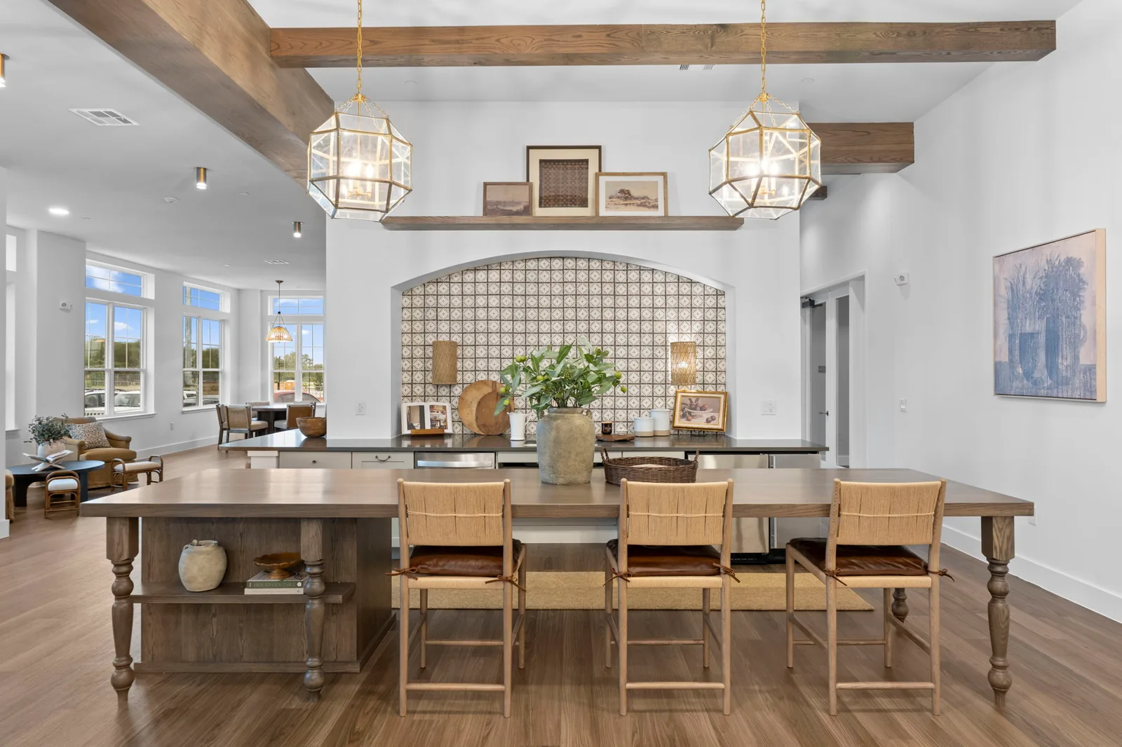 Dining space framed by a brick arch and wood ceiling beams