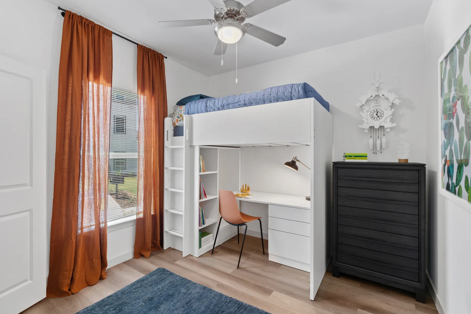 Bedroom with a built-in loft bed and a study nook