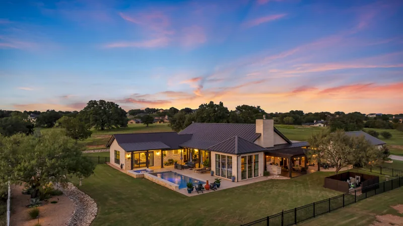 House and lawn photographed from above at twilight