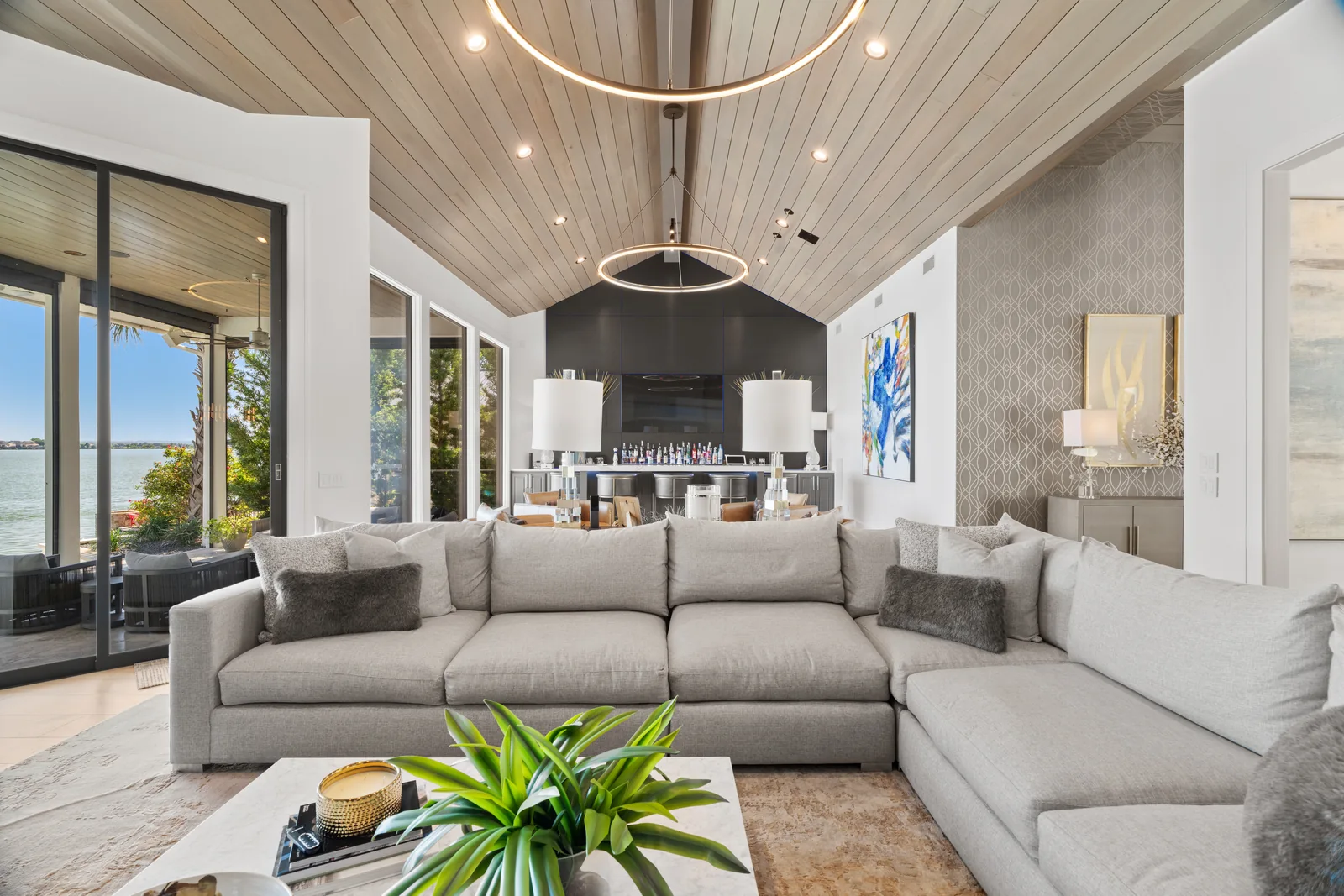 Living room with a window wall and broad seating area