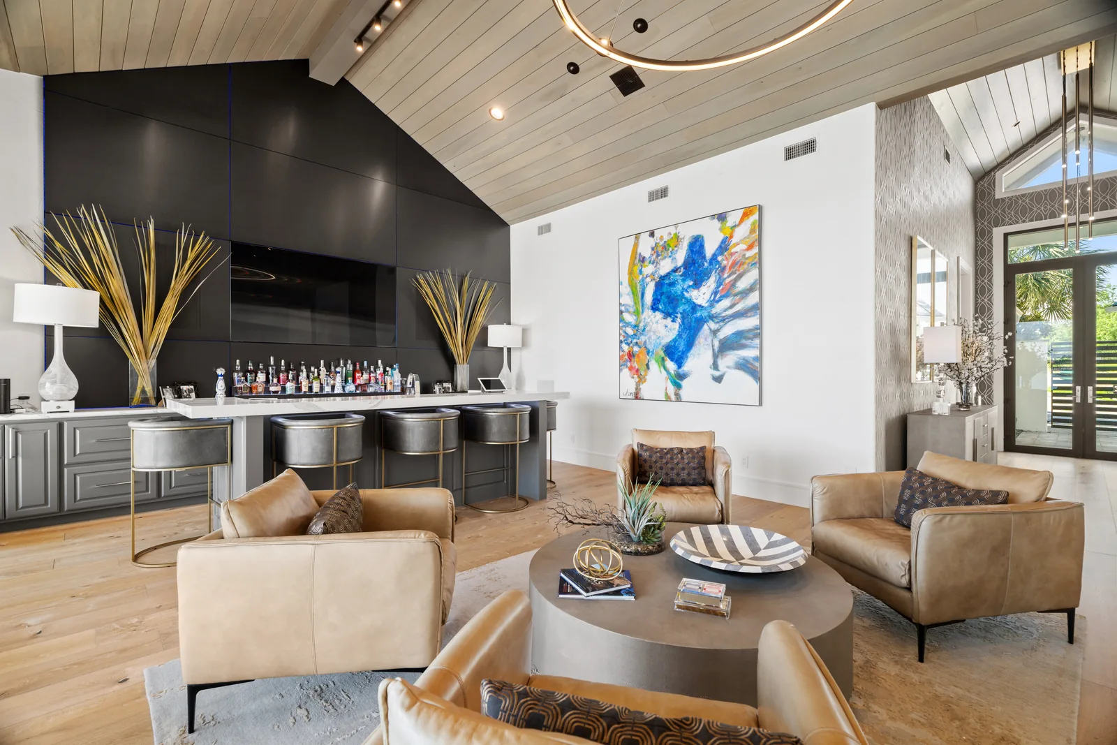 Contemporary lounge with a dark built-in bar and fireplace