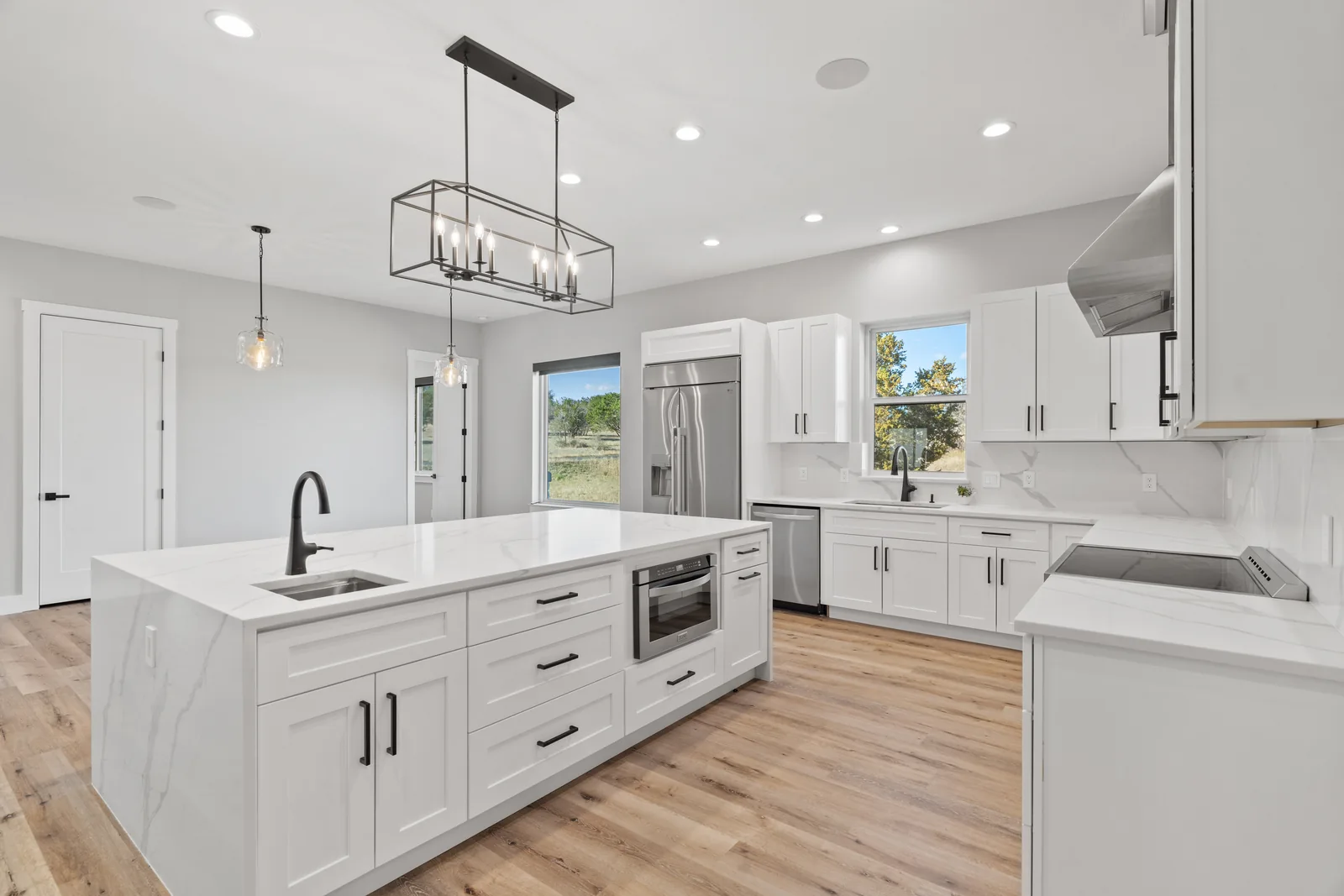 White kitchen with a broad central island