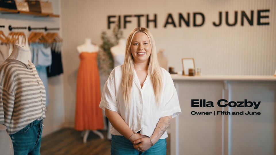 Owner of Fifth and June speaking inside the shop