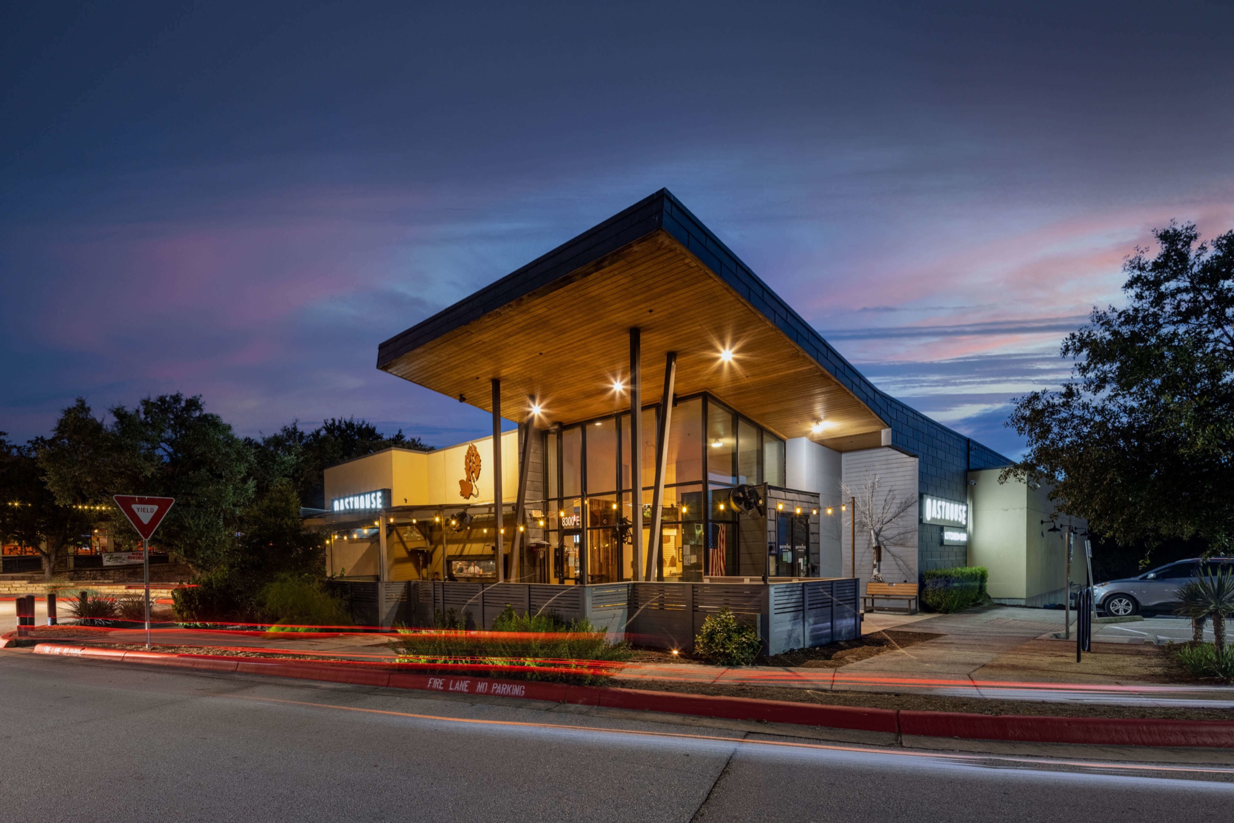 Restaurant exterior at dusk with the entrance illuminated