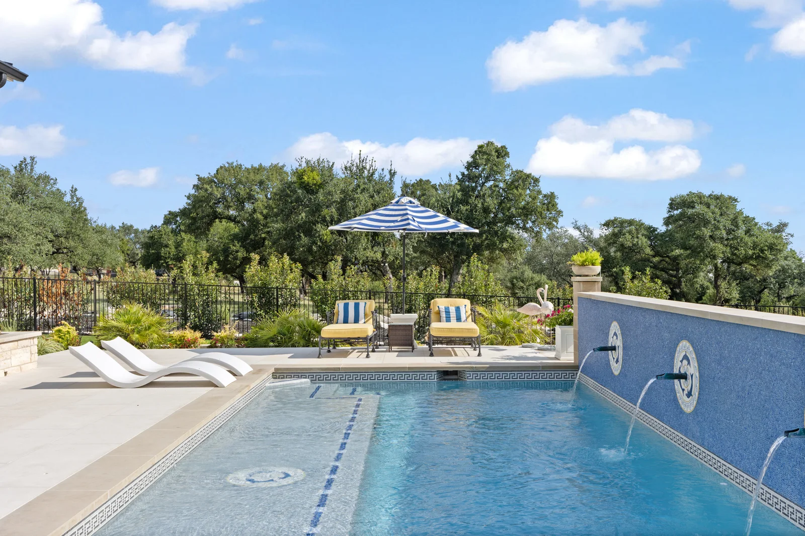 Swimming pool and outdoor living space beside a home