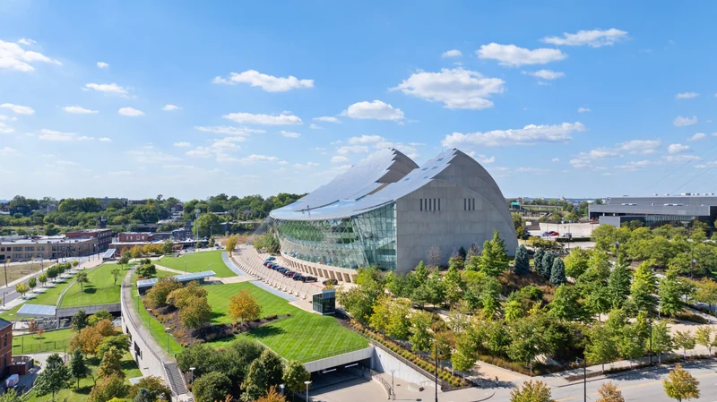 Sculptural commercial building with landscaped grounds seen from above