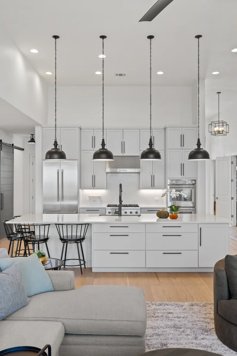 Bright kitchen with a large island and modern pendant lights