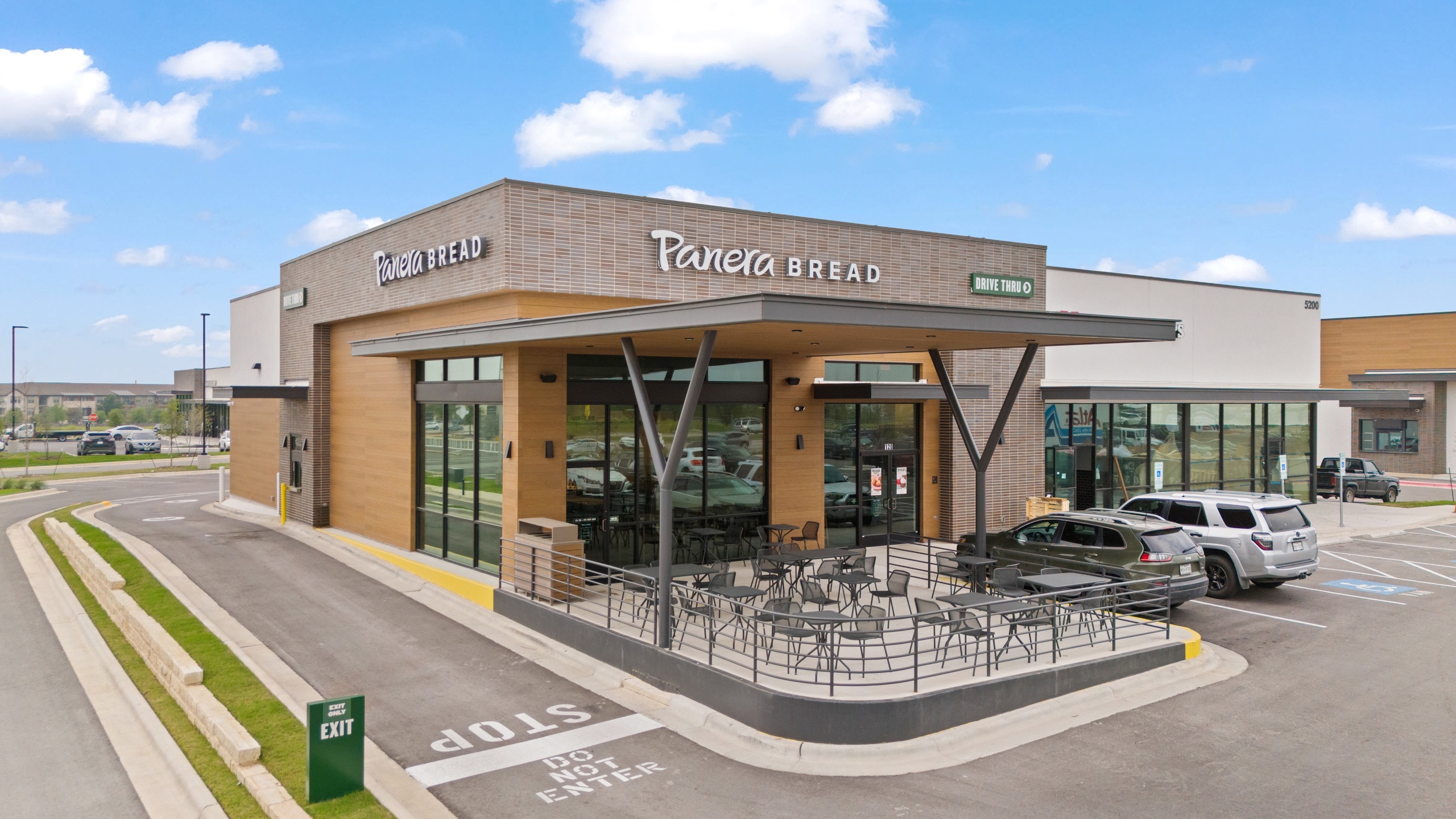 Panera Bread storefront, patio and drive-through at Axis Marketplace