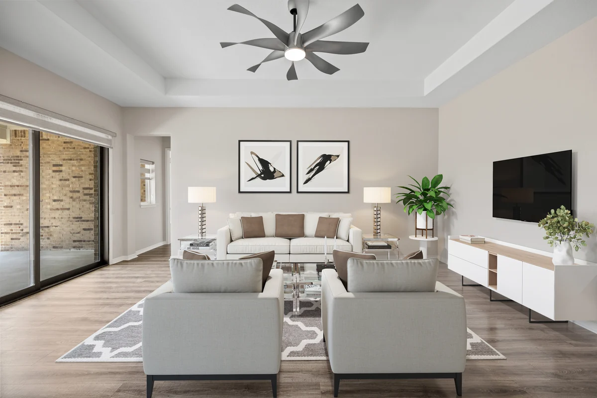 The same living room virtually staged with furniture and artwork
