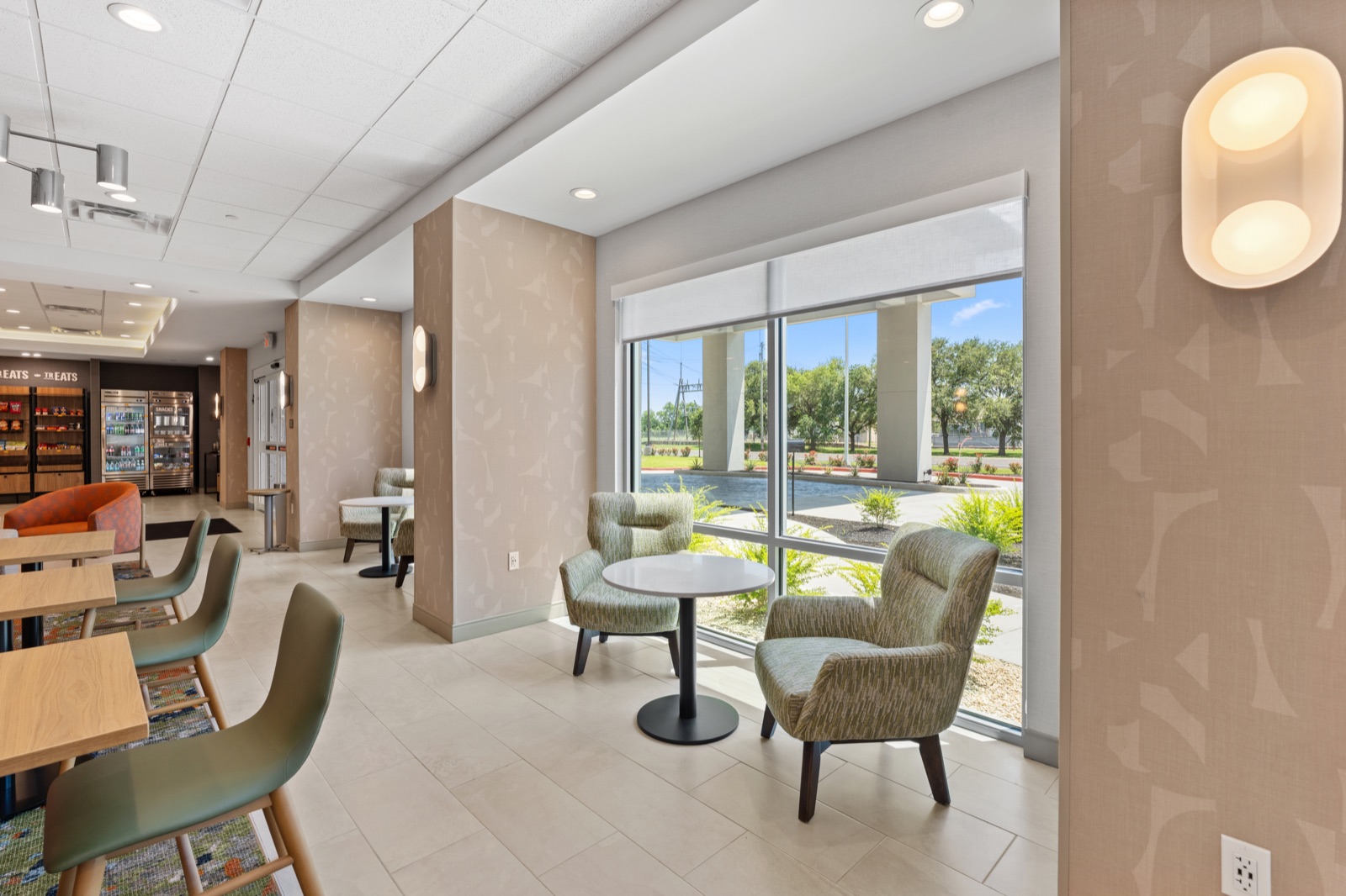 Hotel lobby seating nook beside large windows
