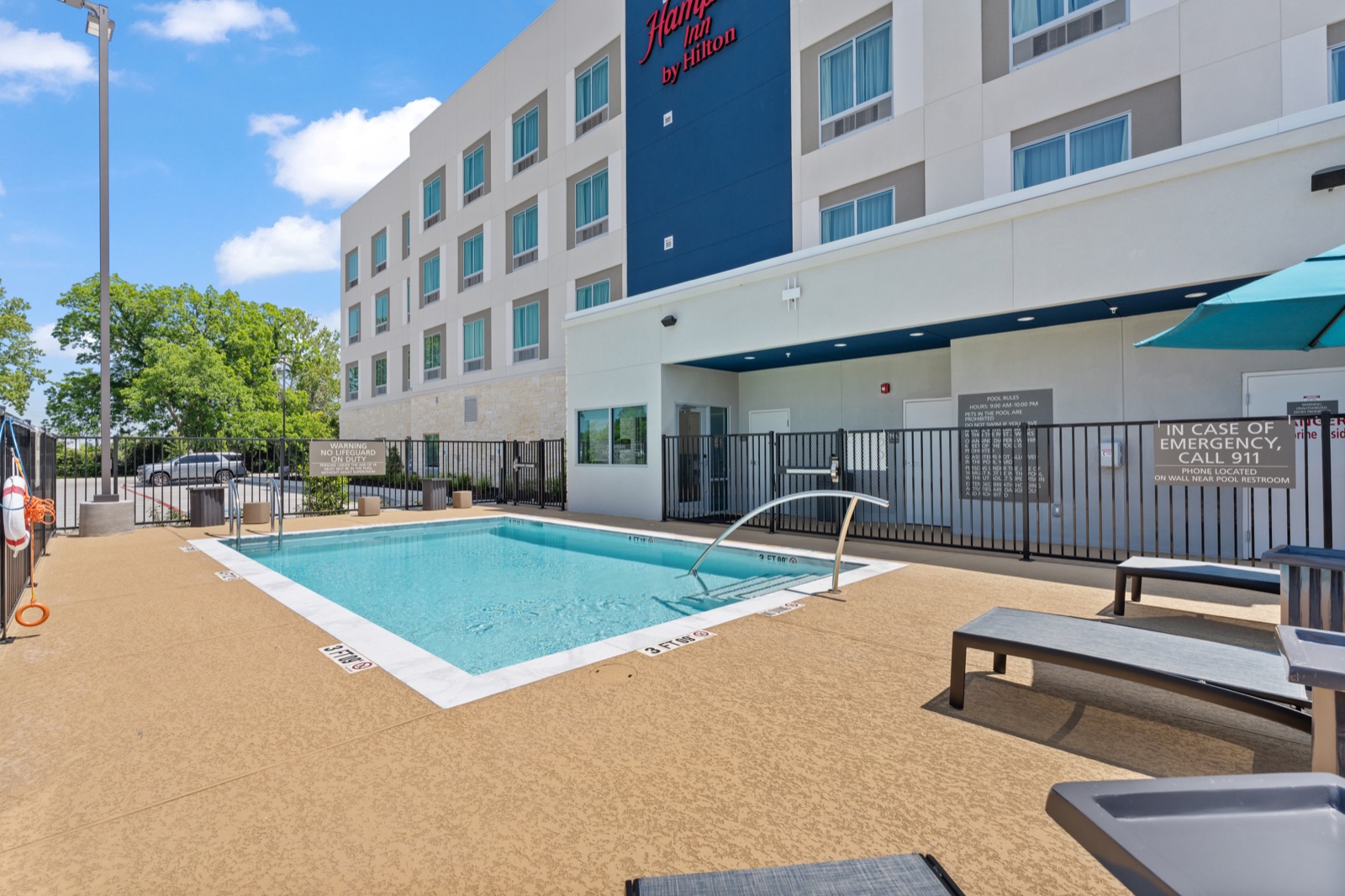 Hotel outdoor pool and lounge chairs
