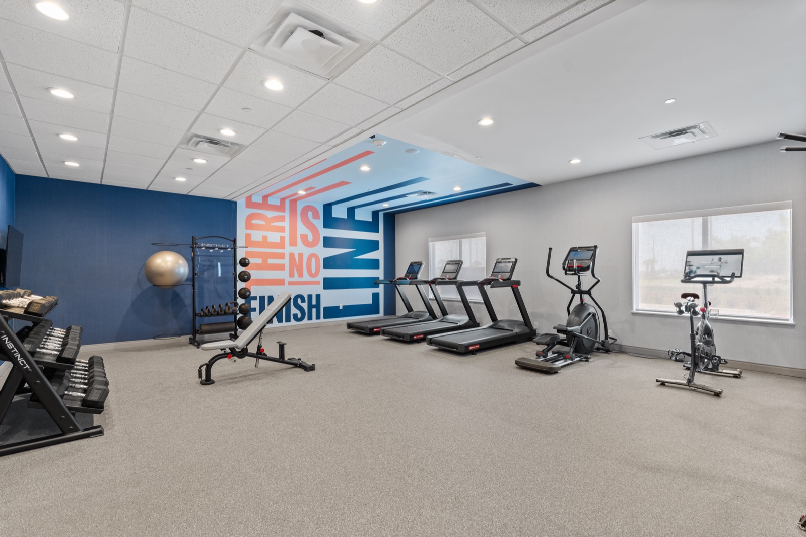 Hotel fitness room with cardio and strength equipment