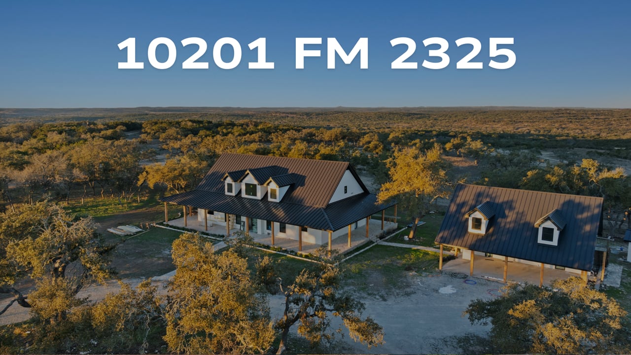 Aerial view of the home and outbuilding at 10201 FM 2325