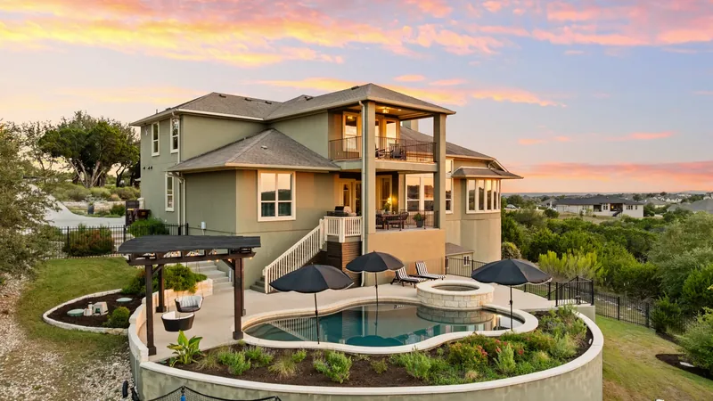Home and circular pool at twilight