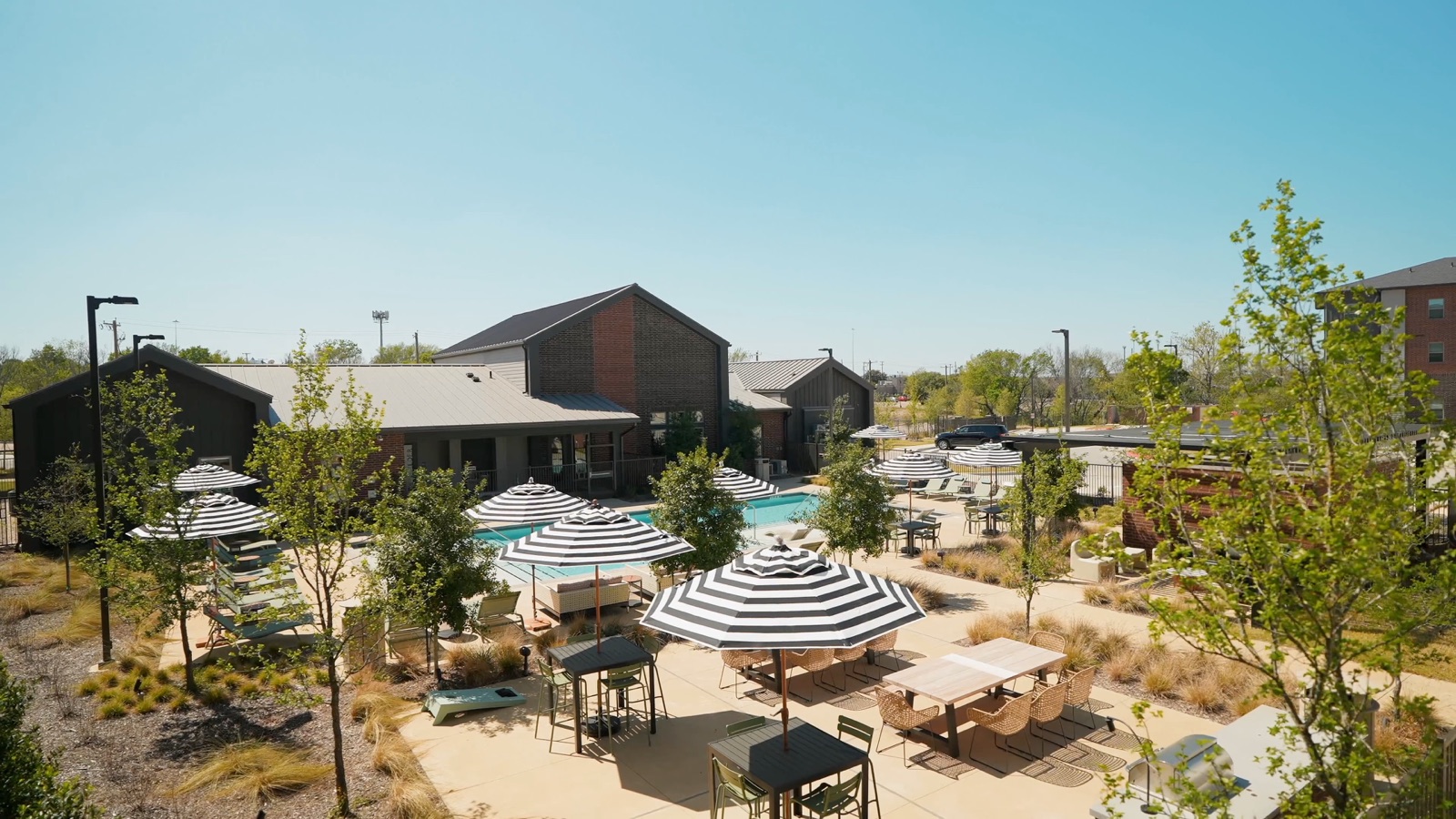 Apartment community exterior and landscaped grounds