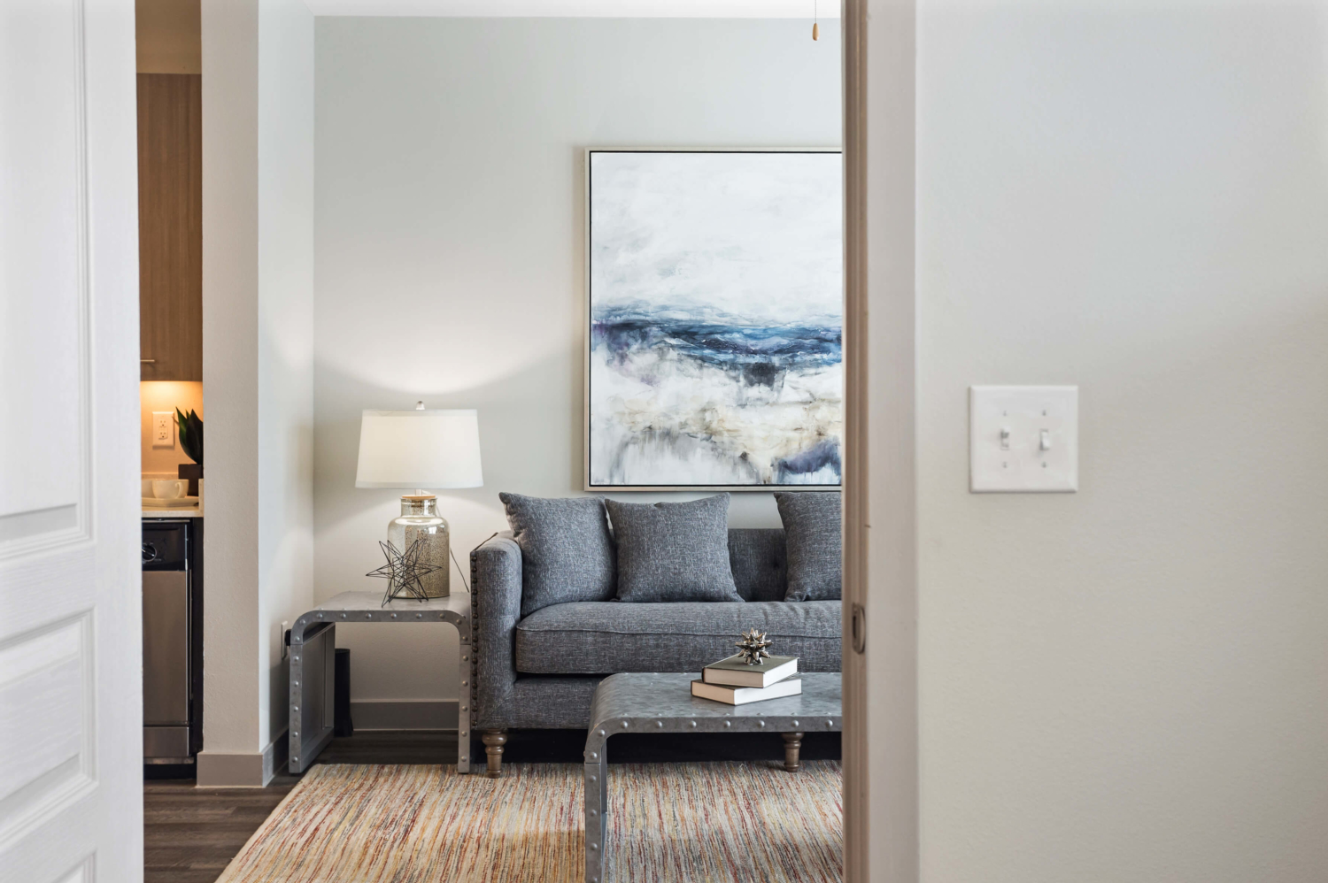 Furnished living room in a Texas apartment model unit.